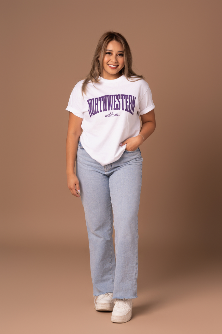 picture of a girl wearing a white cotton t-shirt with purple Northwestern Wildcats screenprinted details