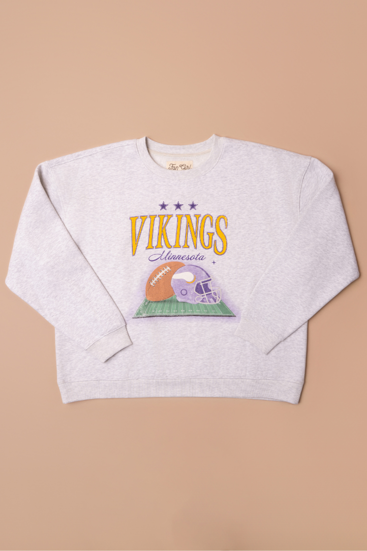 Heather grey crew neck sweatshirt with large yellow 'Vikings' text, purple 'Minnesota' cursive text and a football and helmet graphic under it