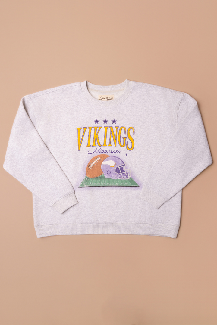 Heather grey crew neck sweatshirt with large yellow 'Vikings' text, purple 'Minnesota' cursive text and a football and helmet graphic under it