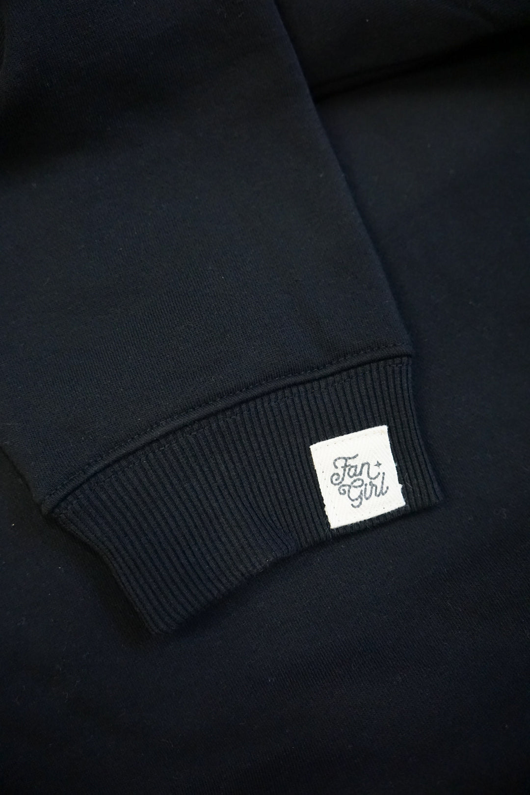 black crew neck sleeve with branded patch
