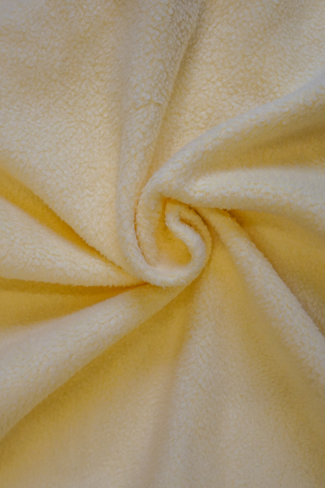 image of the inside of a yellow crewneck with fleece lining
