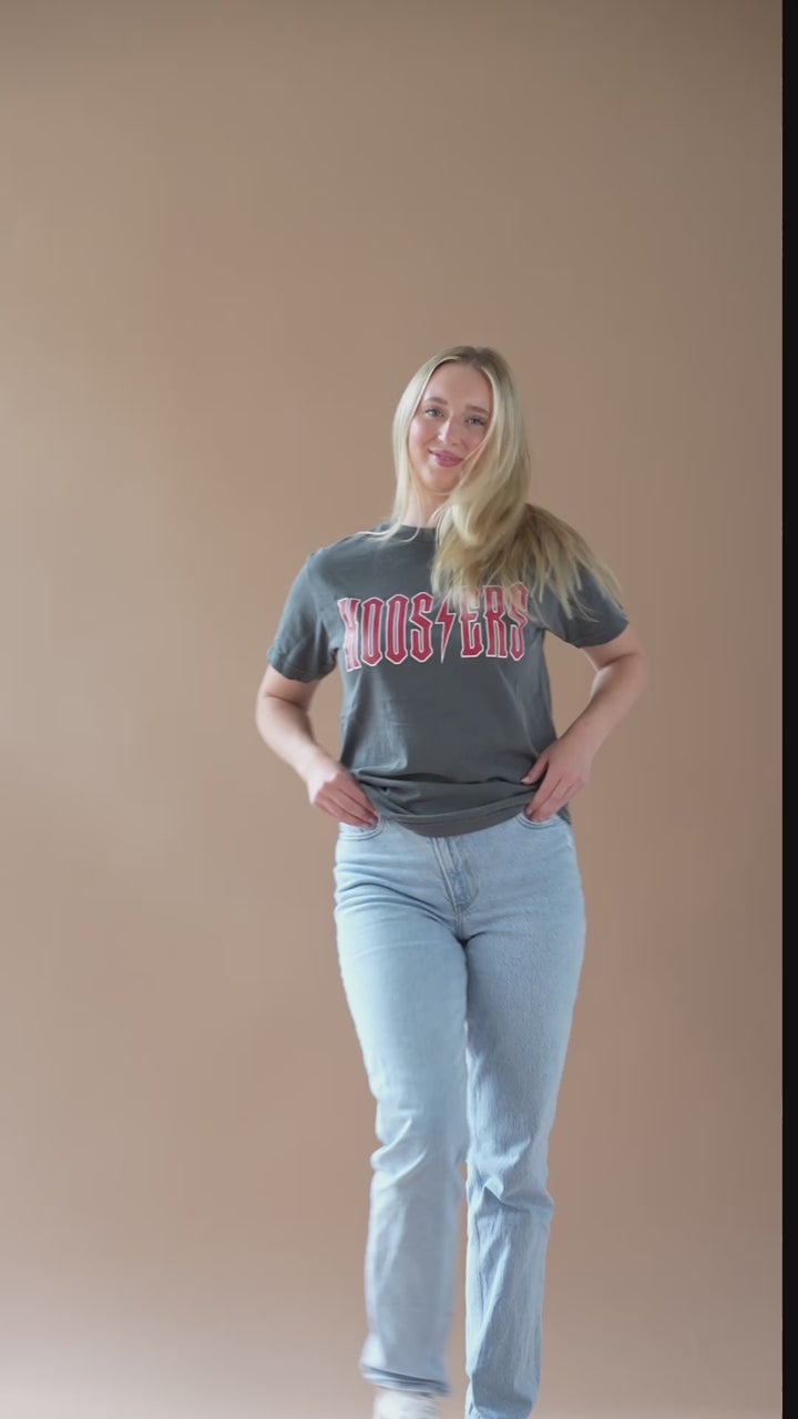 video of a girl wearing a a close up of a girl wearing a faded black Indiana University Hoosiers Vintage Band Tee with crimson and white detail