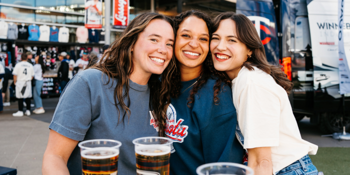 Group photo of 3 girls wearing Minnesota baseball apparel at Target Field 