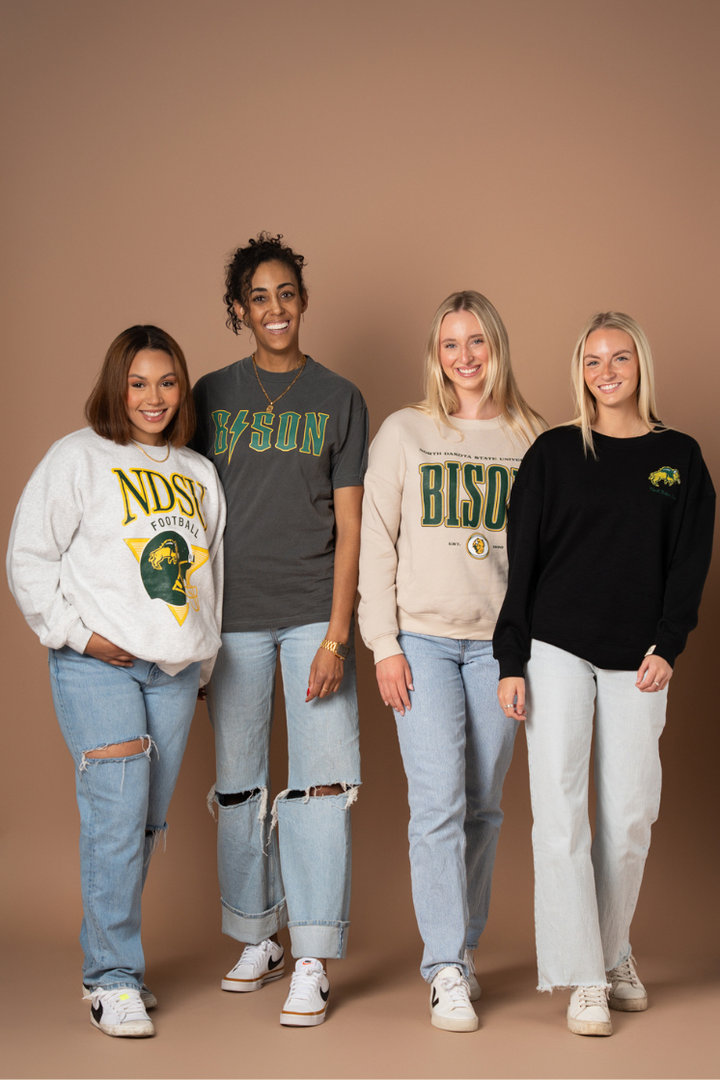 4 girls posing together in all different NDSU Bison styles 