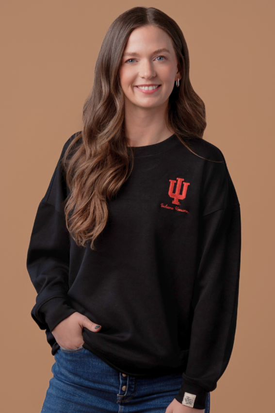 a close up of a girl wearing Hoosiers Supersoft Crew Neck with a black, super soft athleisure material and embroidered crimson University of Indiana logo