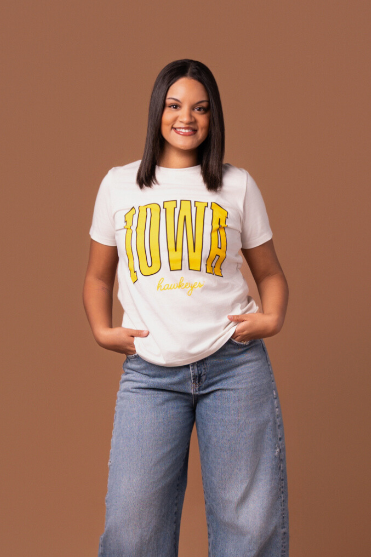 women wearing a white t-shirt with 'Iowa Hawkeyes' text in yellow