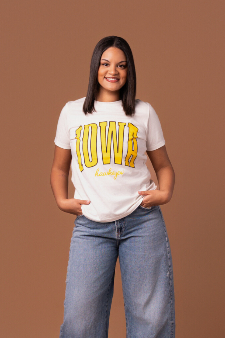 women wearing a white t-shirt with 'Iowa Hawkeyes' text in yellow