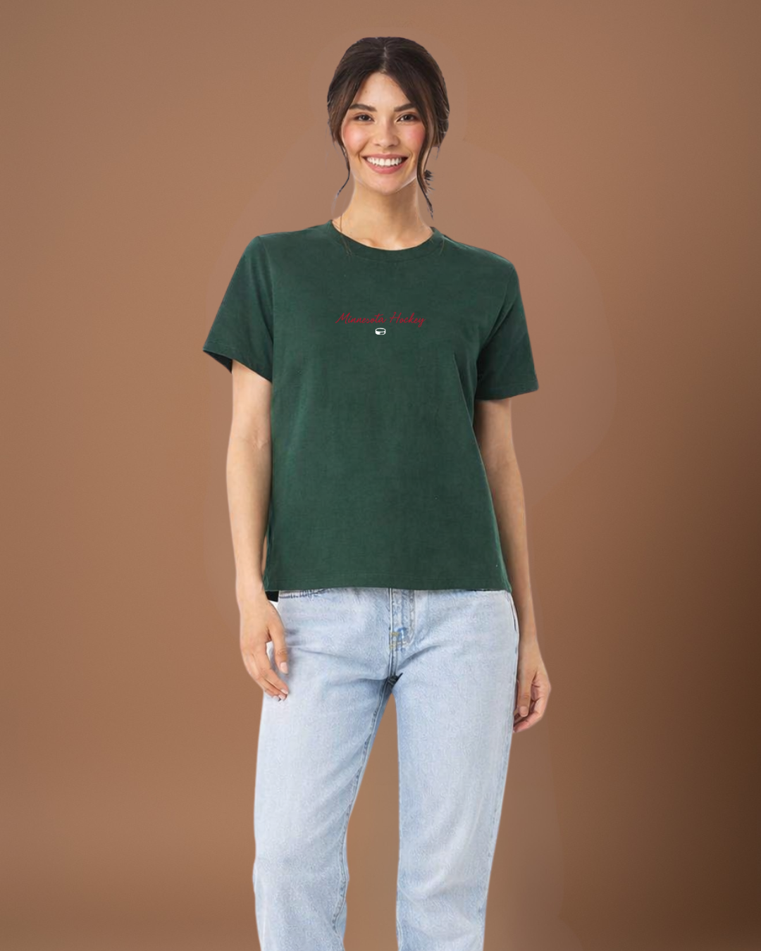 Person wearing a green t-shirt with text on a brown background