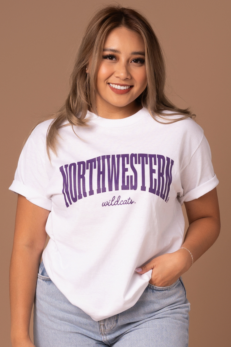 close up picture of a girl wearing a white cotton t-shirt with purple Northwestern Wildcats screenprinted details 