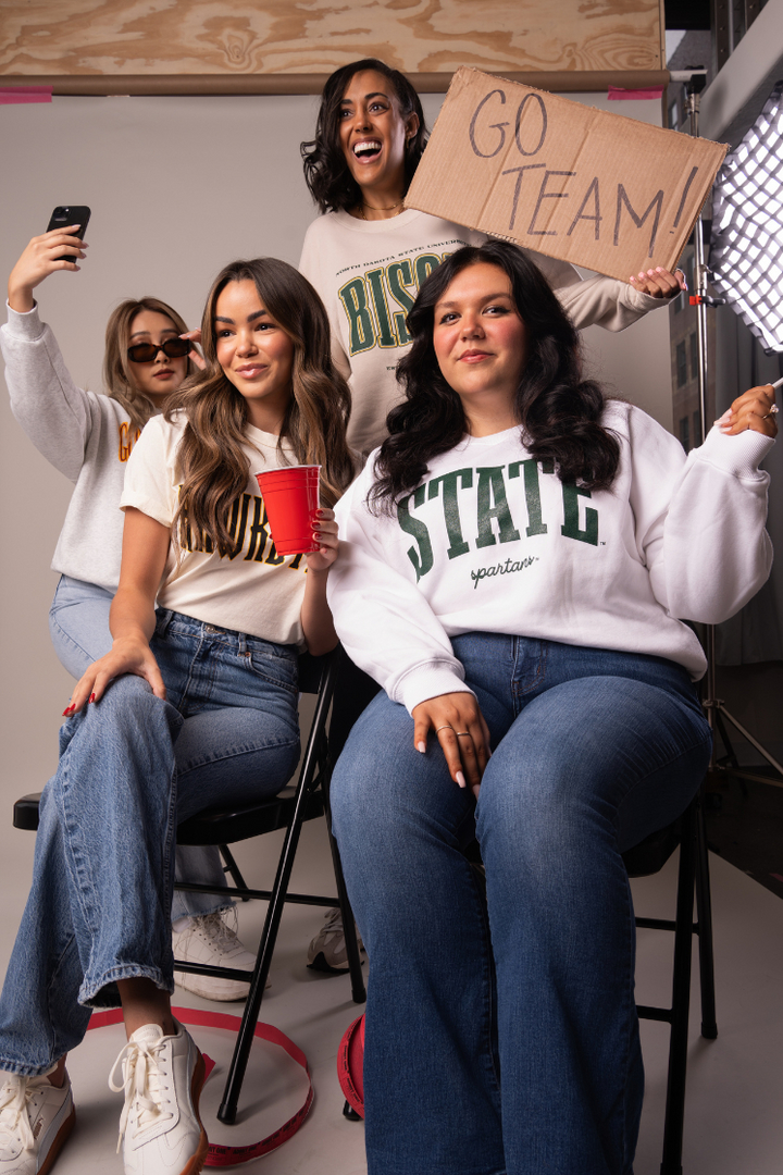 picture of four girls wearing game day apparel by Fan Girl's campus collection