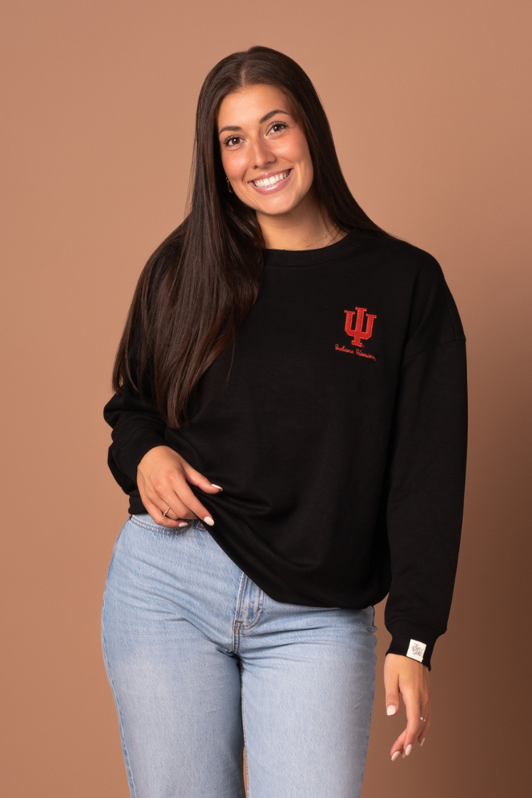 Woman wearing Hoosiers Supersoft Crew Neck with a black, super soft athleisure material and embroidered crimson University of Indiana logo