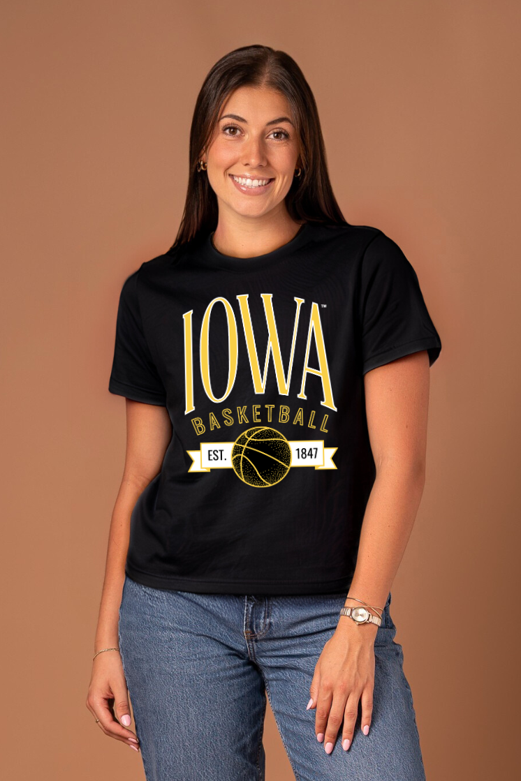 Woman wearing a black 'Iowa Basketball' t-shirt in yellow and white 