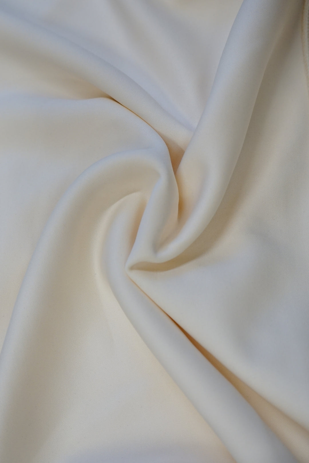 image of the inside of a cream colored supersoft crewneck in twist pattern