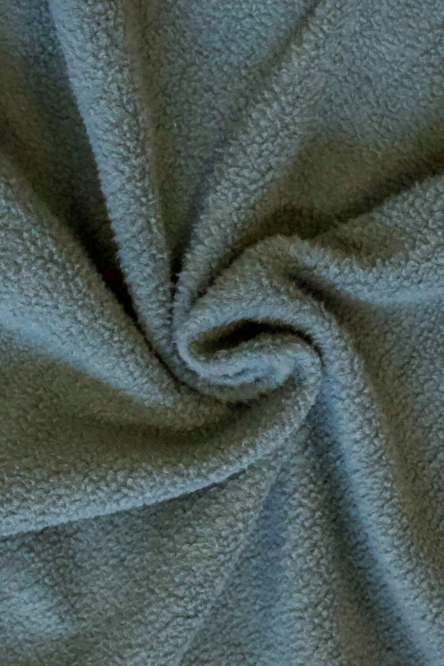 Close-up of textured green soft fabric