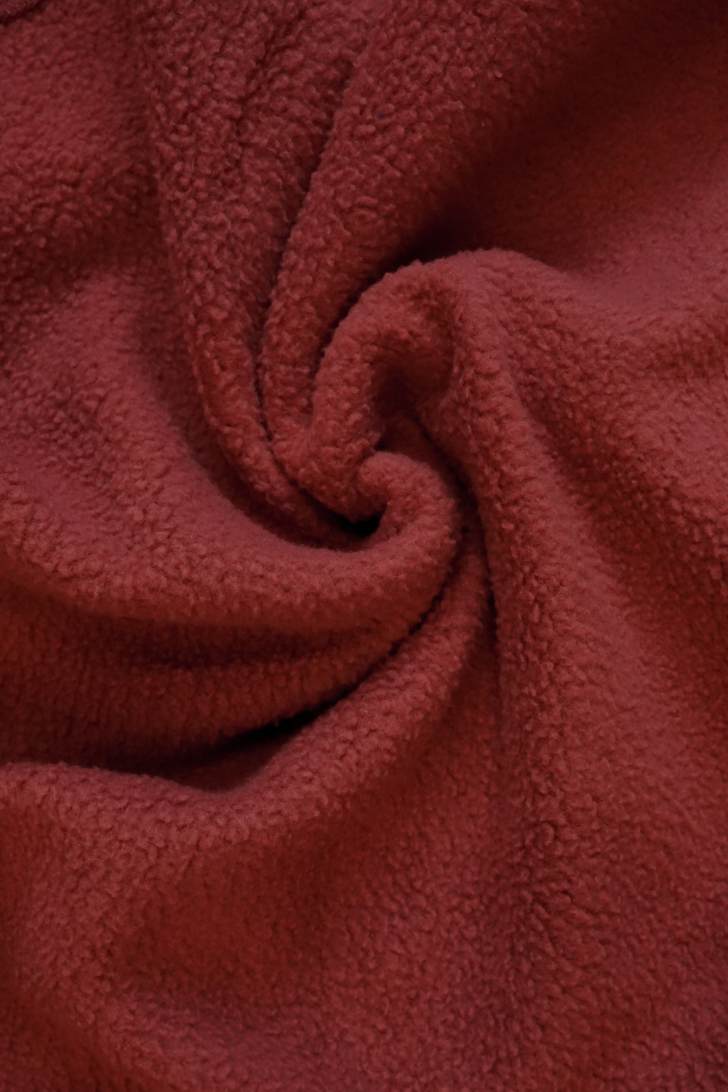 Close-up of soft maroon textured fabric
