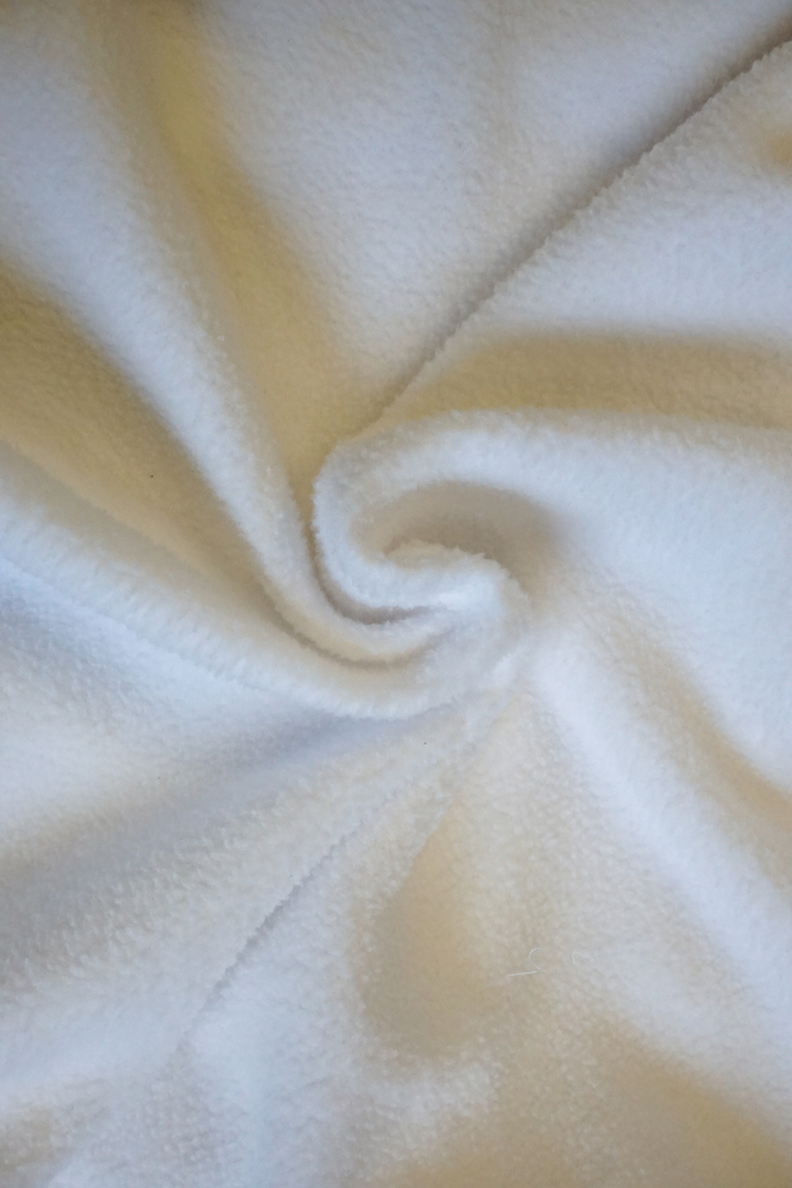 Close-up of light grey fabric with a soft texture