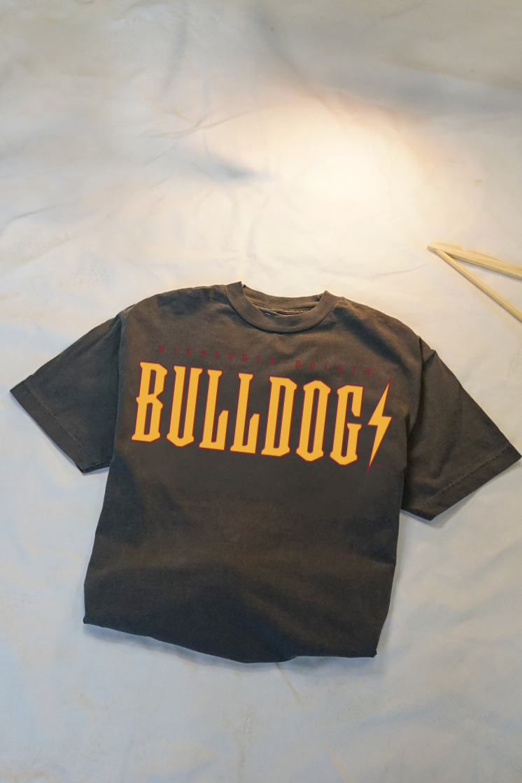 Ash grey t-shirt with 'Bulldogs' printed in yellow and maroon folded on a white background