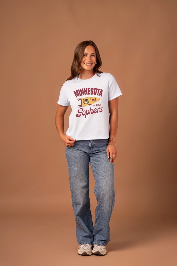 Girl wearing a white t-shirt with 'Minnesota Gopher' text and a yellow pennant with Goldy on it